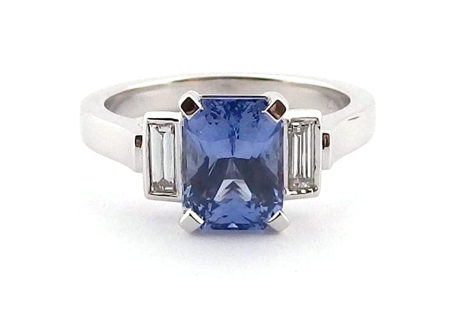 Radiant cut blue sapphire and diamond ring