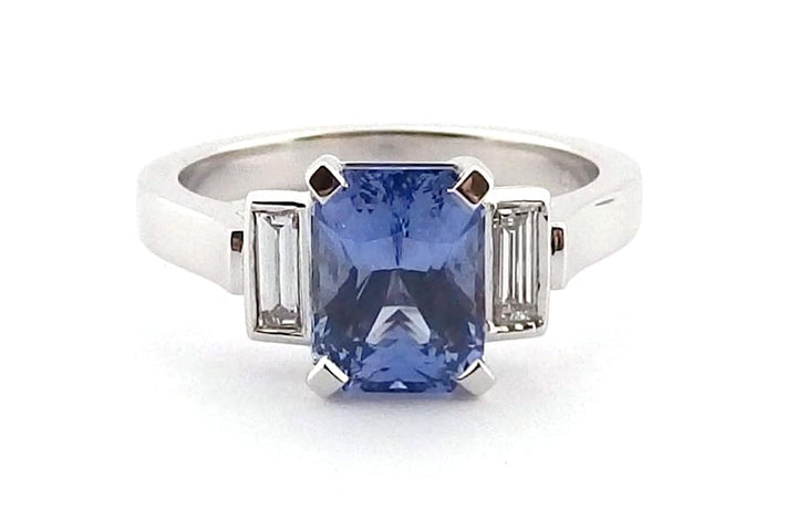 Radiant cut blue sapphire and diamond ring