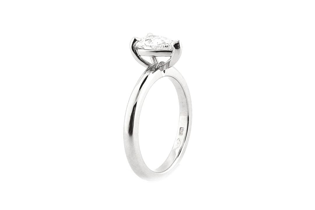 18ct white gold pear shape diamond ring, claw set, rounded band
