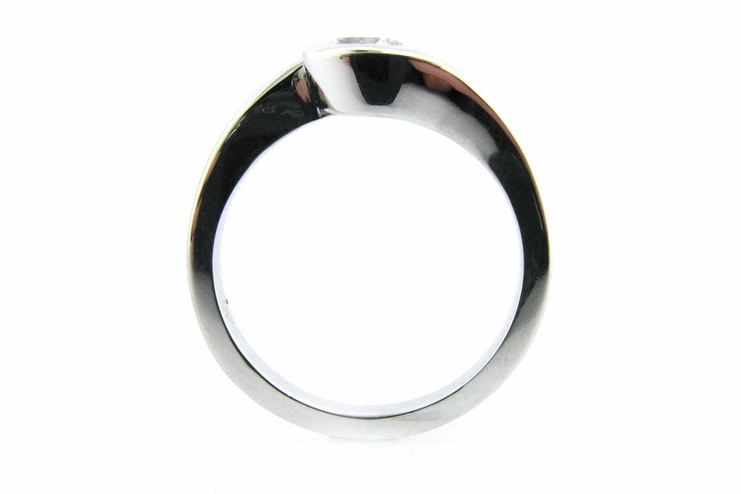 Bezel set round brilliant cut diamond ring with a twisted band