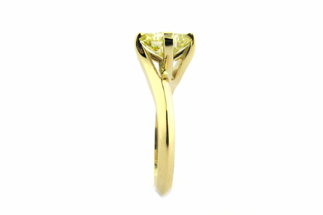Fancy yellow diamond ring with a twisted band