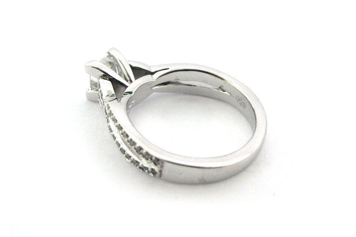 Princess cut diamond ring with a double twisted band