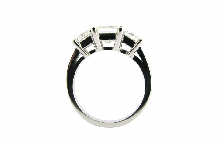 Three stone princess cut diamond ring