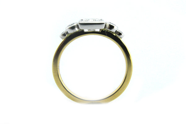 Two tone bezel set princess and round brilliant cut diamond ring