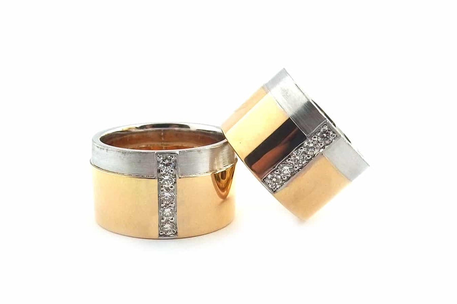Two tone same sex ring set with bead set diamonds