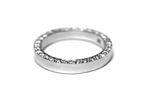 Wedding ring with diamonds set on the edge