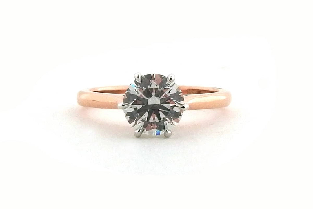 White and rose gold round brilliant cut ring