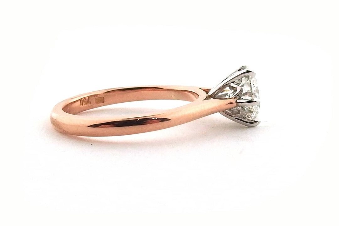 White and rose gold round brilliant cut ring