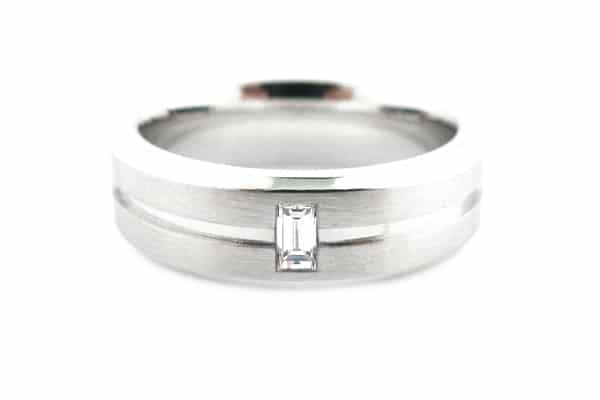 White gold men's wedding band with a baguette diamond