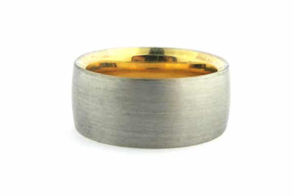 White gold men's wedding band with a yellow gold sleeve