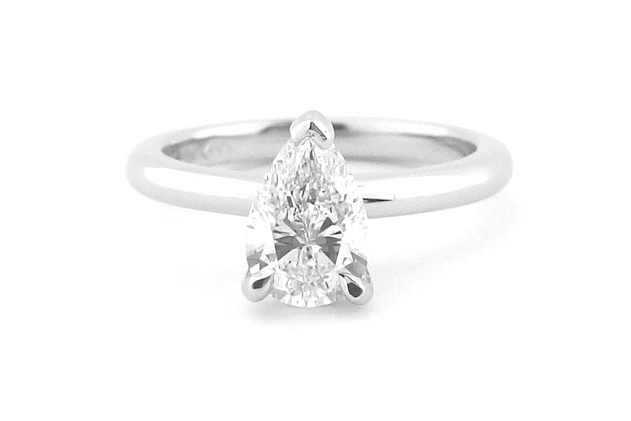 18ct white gold pear shape diamond ring, claw set, rounded band