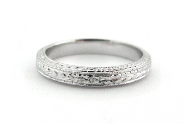 Ladies wedding band with engraving on three sides