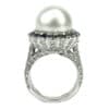 Pearl set in halo of black diamonds on white gold engagement ring