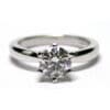 Round brilliant cut diamond six prong set in minimalist white gold wedding ring