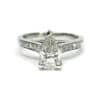 Trilliant cut diamond v-shape set in white gold band with row of diamonds