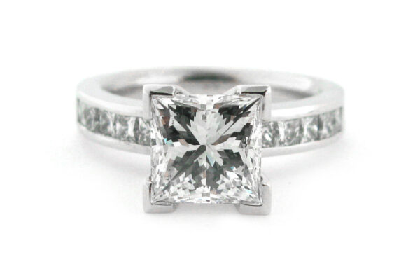 Princess cut diamond ring with channel princess cut diamonds in the band