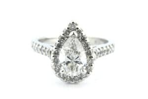 Claw set pear shape diamond halo ring