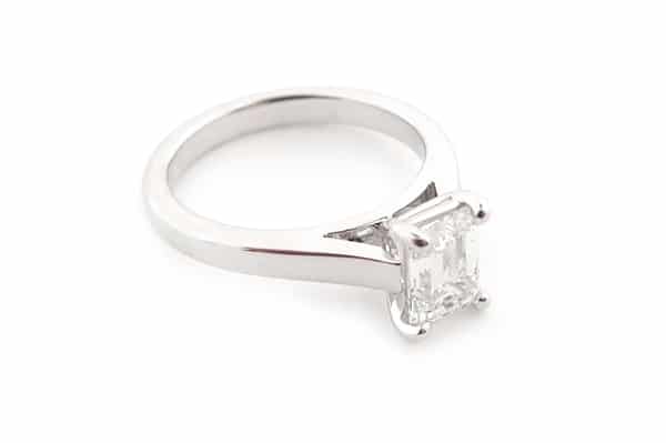 Emerald cut diamond claw set solitaire ring side view