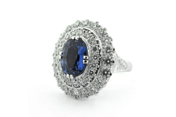 Blue oval sapphire ring with a double halo