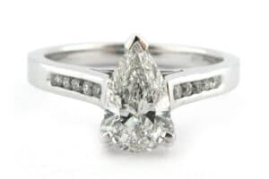 Pear shape diamond ring with channel set diamonds