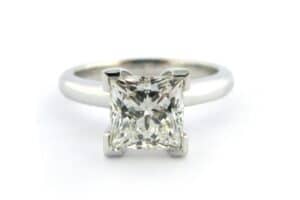 Princess cut diamond ring with a rounded band