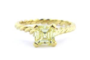 Yellow asscher cut diamond ring with a twisted band
